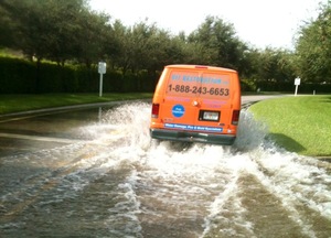 Water Damage Plantsville Van Driving Down Flooded Street